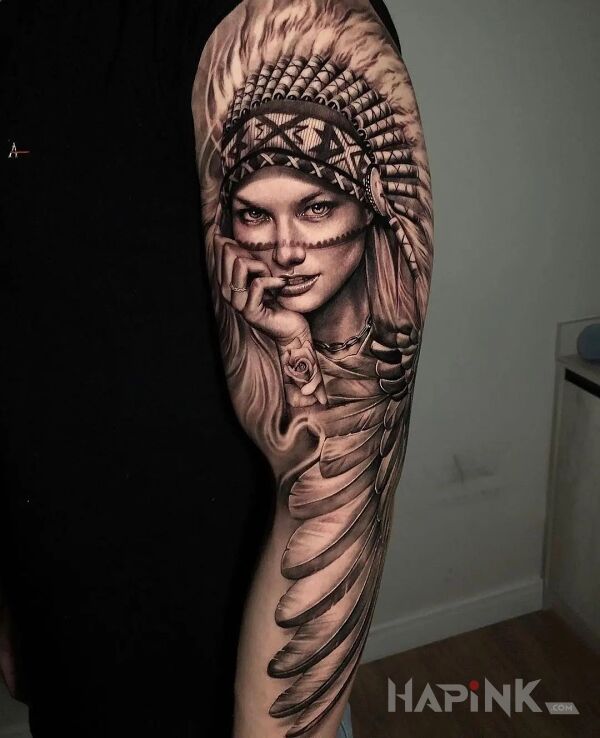 Tattoo Uwodząca indianka in black and gray motif and realistic style on the upper arm