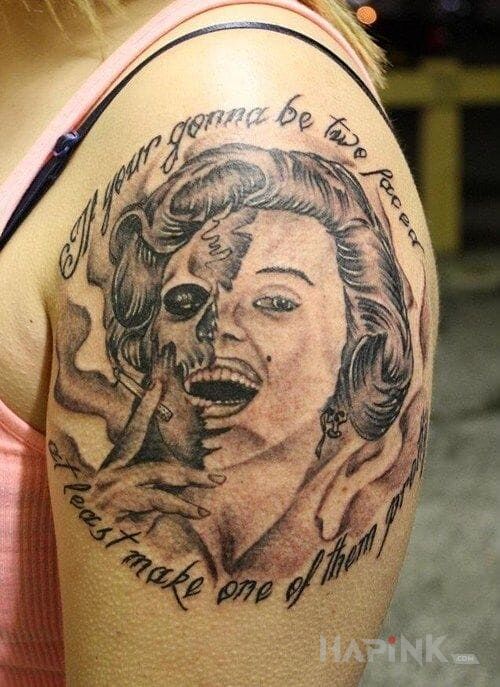 Tattoo Slynna aktorka in characters motif on the upper arm