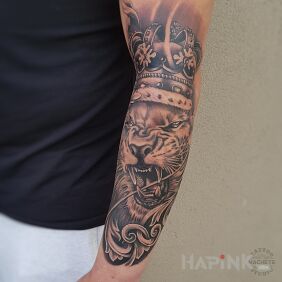 Tattoo Evil lion On the arm motif: animals style: realistic