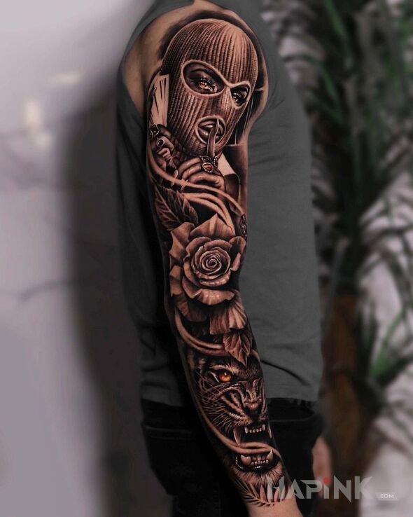 Tattoo Laska w kominiarce in faces motif and realistic style on the forearm