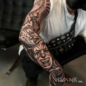 Tattoo Theatrical masks on the hand motif: black and gray style: realistic