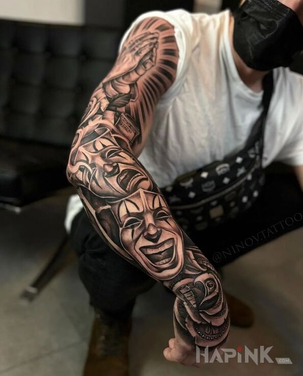 Tattoo Teatralne maski in sleeves motif and realistic style on the forearm
