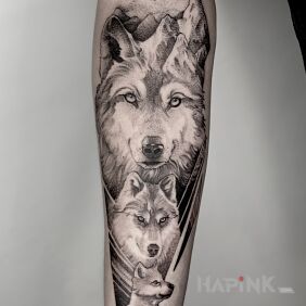 Tattoo Wolf / Wolves / Family / Mountains on the forearm motif: black and gray style: dotwork