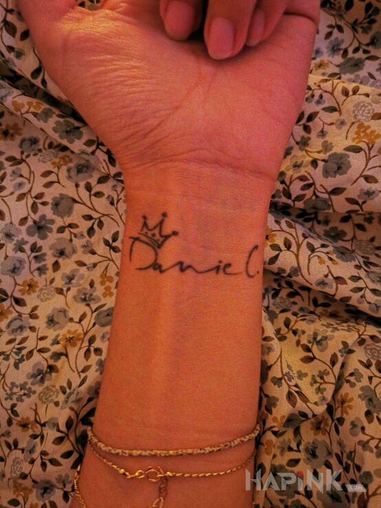 Tattoo Imię in lettering motif On the arm
