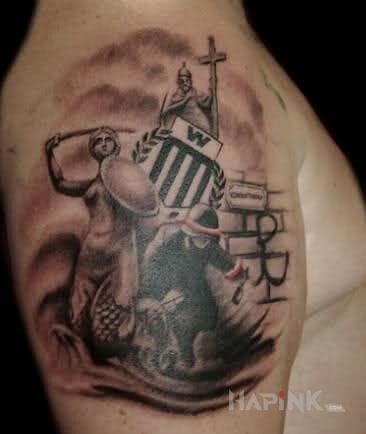 Tattoo Warszawa in patriotic motif on the upper arm