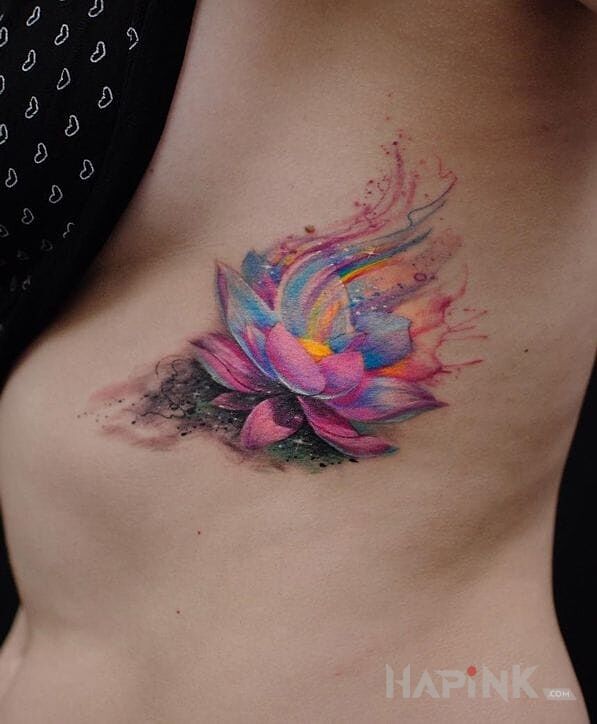 Tattoo Kwiat lotosu in flowers motif on the ribs
