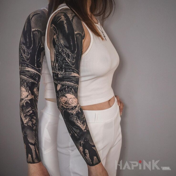 Tattoo Alien i Predator in black and gray motif and realistic style on the forearm