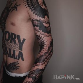 Tattoo Dangerous snake on the forearm motif: black and gray style: graphic / illustrative