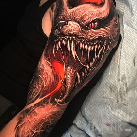 Tattoo Beast's face on the upper arm motif: colorful style: realistic