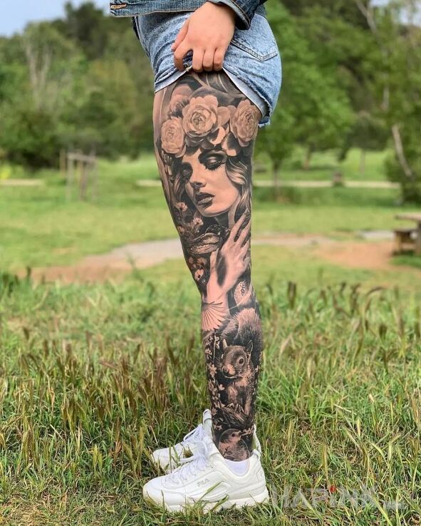 Tattoo Pani wiosna in faces motif and realistic style on the leg
