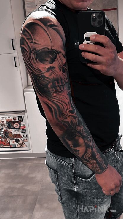 Tattoo Czaszka in sleeves motif and realistic style On the arm