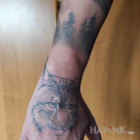 Tattoo Lynx on the hand motif: animals style: realistic