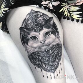 Tattoo Kocur on the leg motif: animals