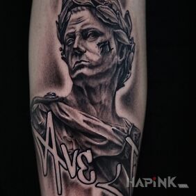 Tattoo Cesar on the forearm motif: black and gray style: graffiti