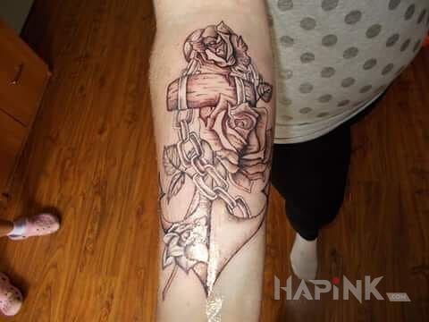 Tattoo Mój pierwszy.. :-) in flowers motif on the forearm