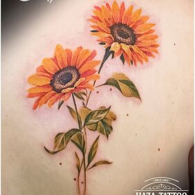 Tattoo Sunflowers on the back motif: flowers style: realistic