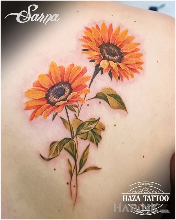 Tattoo Sunflowers in colorful motif and realistic style on the shoulder blades