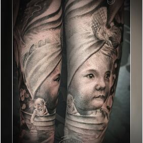 Tattoo Portrait of a girl on the forearm motif: black and gray style: realistic