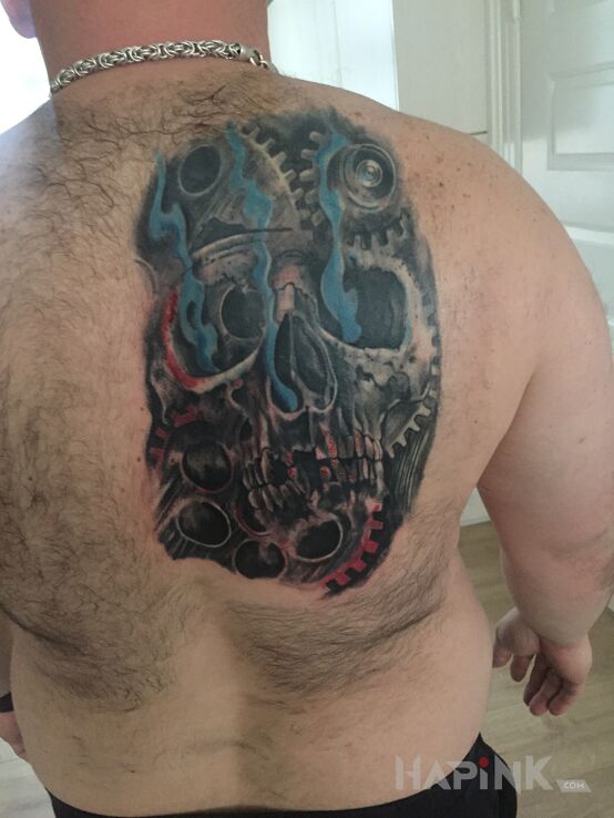 Tattoo Czacha bio in black and gray motif and realistic style on the shoulder blades