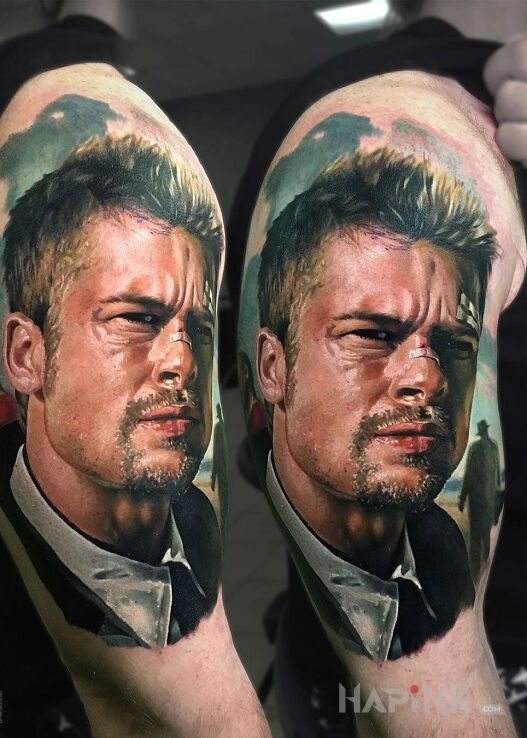 Tattoo Brad Pitt in characters motif and realistic style on the upper arm