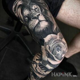 Tattoo Rose lion on the tibia motif: animals style: realistic