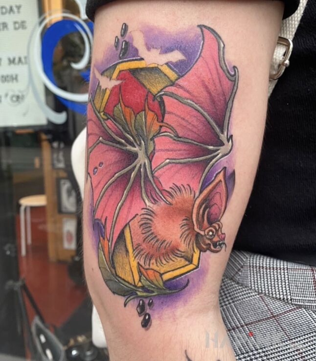 Tattoo Batman in animals motif and neo-traditional style on the upper arm