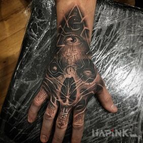 Tattoo Cybernetics on the hand motif: skulls