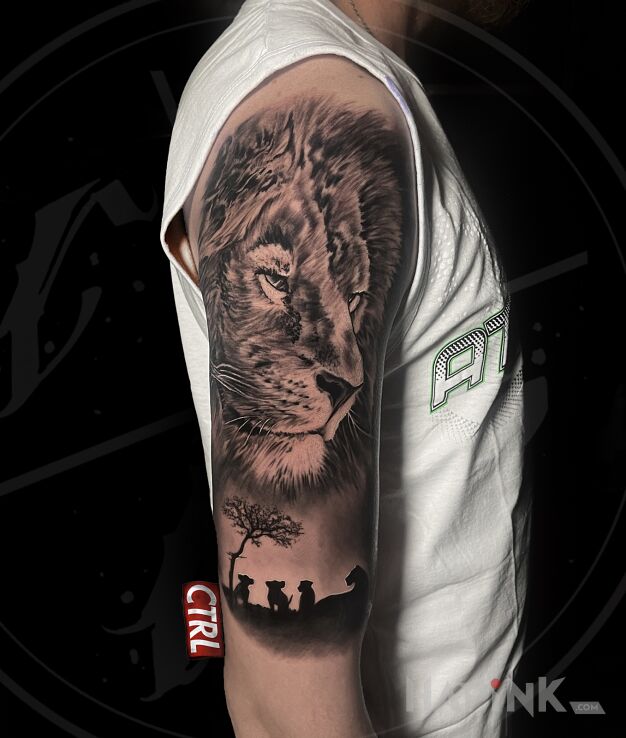 Tattoo Lew i rodzina in animals motif and realistic style on the upper arm