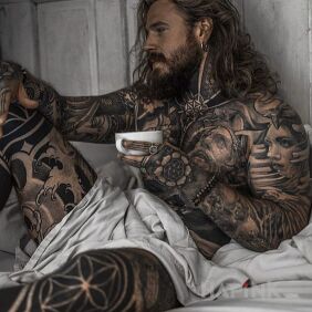 Tattoo Long-haired gentleman on the leg motif: black and gray style: blackwork / blackout