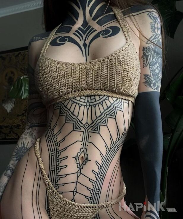 Tattoo Dziewczyna z plemienia in sleeves motif and blackwork / blackout style on the chest