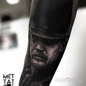 Tattoo Tom Hardy by Michał On the arm motif: black and gray style: realistic