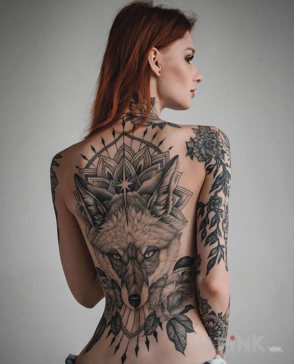 Tattoo Lis u rudej in mandalas motif and realistic style on the upper arm