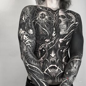 Tattoo Dark personality on the forearm motif: sleeves style: blackwork / blackout