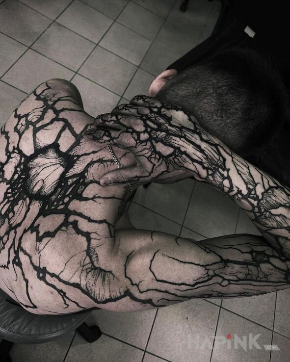 Tattoo Walniety przez pioruin in other motif and blackwork / blackout style on the forearm