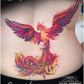 Tattoo Cover done with a phoenix on the back motif: fantasy style: graphic / illustrative