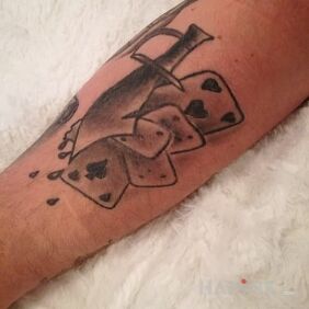 Tattoo Gambling on the forearm motif: objects