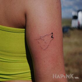 Tattoo Wolf howl On the arm motif: animals style: minimalistic