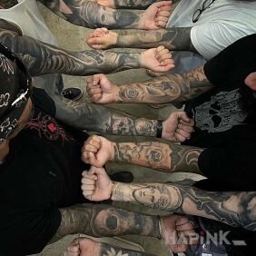 Tattoo Tattooed paws on the forearm motif: flowers style: realistic