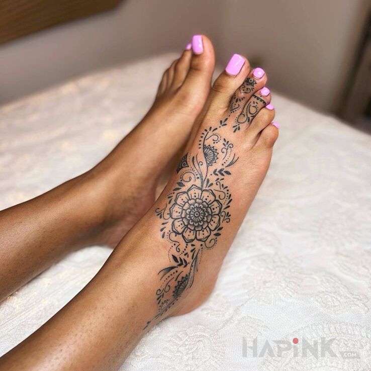 Tattoo Stopka in flowers motif and graphic / illustrative style near the ankle