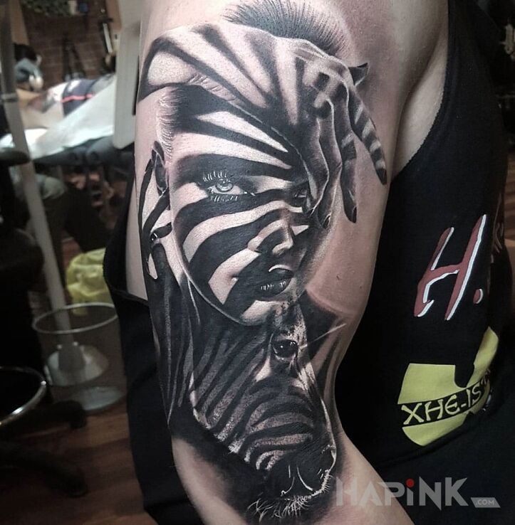 Tattoo Zebra in characters motif on the upper arm