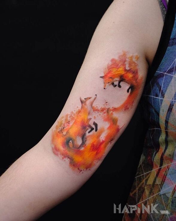 Tattoo Dwa lissy in colorful motif and Watercolor style on the upper arm