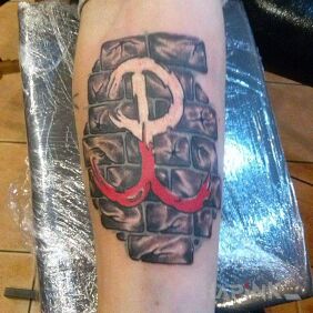 Tattoo Fighting Poland on the forearm motif: black and gray style: realistic