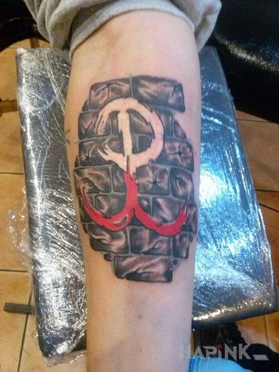 Tattoo Polska walcząca in black and gray motif and realistic style On the arm