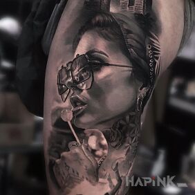 Tattoo Cizia with a lollipop on the leg motif: faces style: realistic
