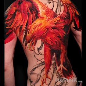 Tattoo Dark fenix rises on the shoulder motif: colorful style: realistic