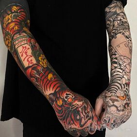 Tattoo Tigers in two colors On the arm motif: sleeves style: japanese / irezumi
