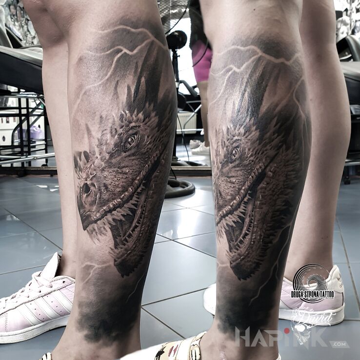 Tattoo Game of Thrones - DROGON in black and gray motif and realistic style on the calf