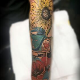 Tattoo Beetle in Flowers On the arm motif: flowers style: Watercolor