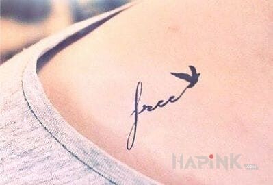 Tattoo Free in lettering motif on the collarbone