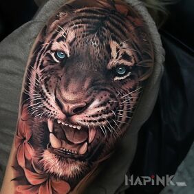 Tattoo Tiger's Smile On the arm motif: flowers style: realistic